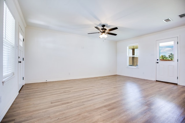 909 E 39th St, San Angelo, TX 76903 - foyer featuring crown molding, a ceiling fan, and light wood-type flooring