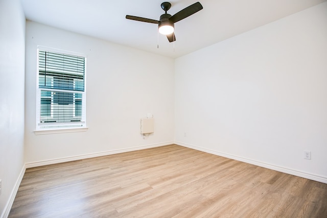 909 E 39th St, San Angelo, TX 76903 - unfurnished room with wood finished floors, healthy amount of natural light, and a ceiling fan