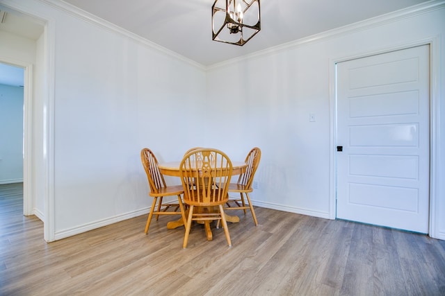 909 E 39th St, San Angelo, TX 76903 - dining room featuring a chandelier, wood finished floors, and ornamental molding