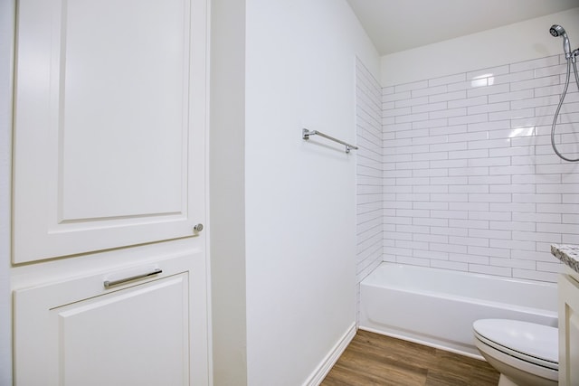 909 E 39th St, San Angelo, TX 76903 - full bath featuring wood finished floors,  shower combination, and vanity