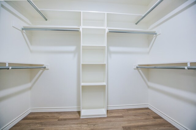 909 E 39th St, San Angelo, TX 76903 - walk in closet with wood finished floors