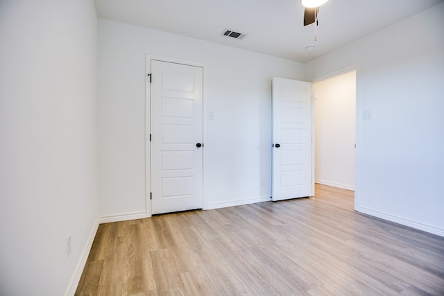 909 E 39th St, San Angelo, TX 76903 - unfurnished bedroom with light wood-style flooring and a ceiling fan
