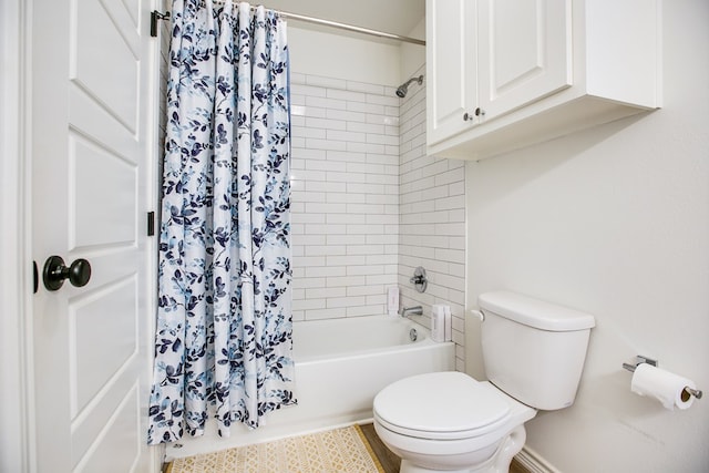 909 E 39th St, San Angelo, TX 76903 - bathroom featuring shower / bath combo with shower curtain and toilet