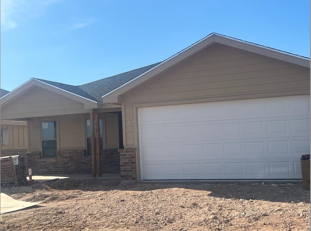 single story home with a garage