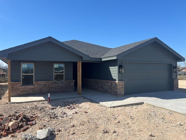 single story home with a garage