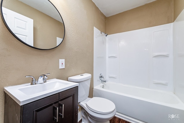 full bathroom featuring toilet, vanity, and  shower combination