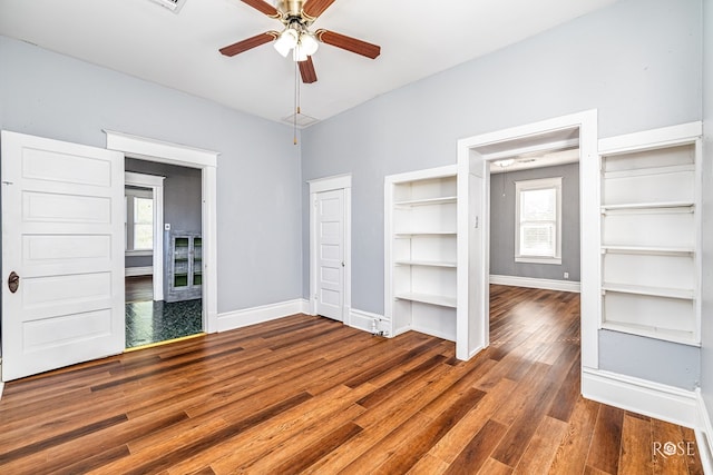2 N Adams St, San Angelo, TX 76901 - unfurnished bedroom featuring wood finished floors and a ceiling fan