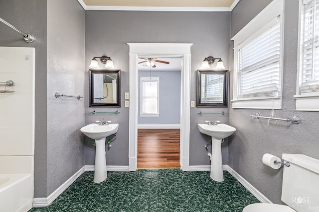 2 N Adams St, San Angelo, TX 76901 - bathroom featuring a ceiling fan and shower / bath combination