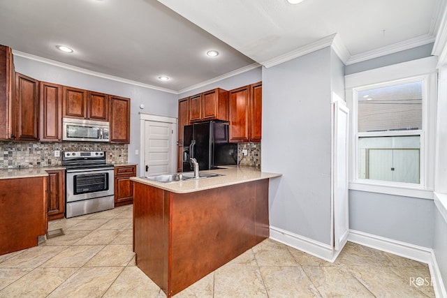 2 N Adams St, San Angelo, TX 76901 - kitchen featuring stainless steel appliances, tasteful backsplash, crown molding, a peninsula, and light countertops