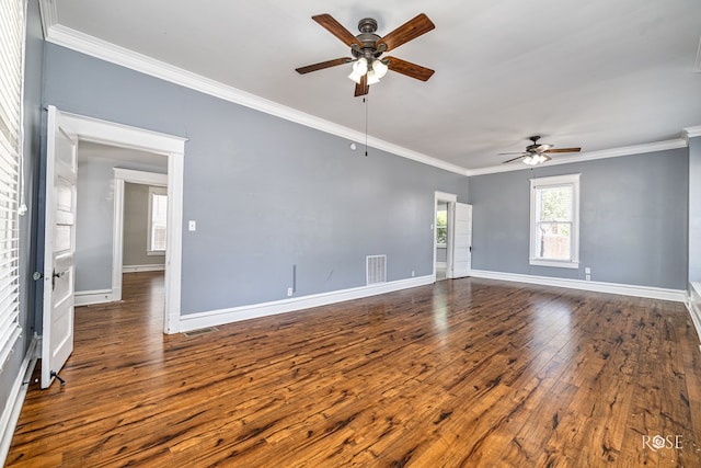 2 N Adams St, San Angelo, TX 76901 - spare room featuring a ceiling fan, ornamental molding, and dark wood-type flooring