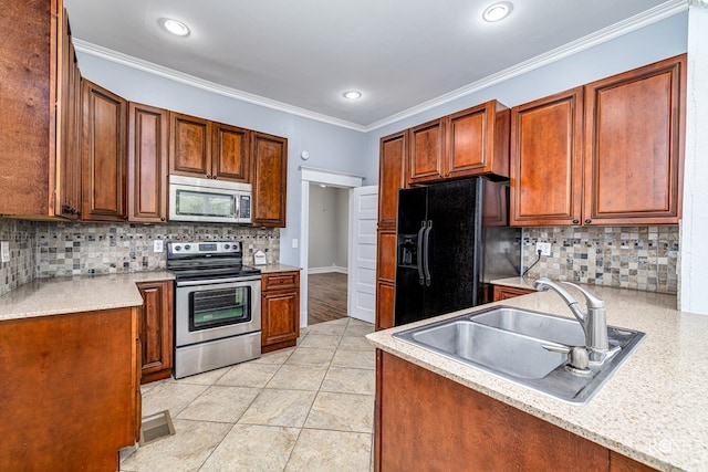 2 N Adams St, San Angelo, TX 76901 - kitchen featuring appliances with stainless steel finishes, tasteful backsplash, light countertops, crown molding, and recessed lighting