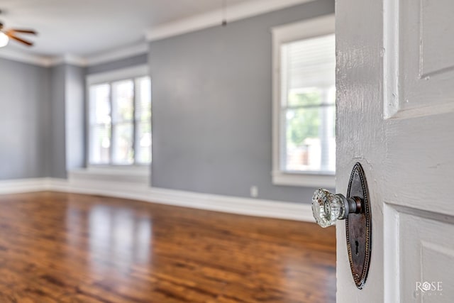 2 N Adams St, San Angelo, TX 76901 - unfurnished living room with wood finished floors and ceiling fan