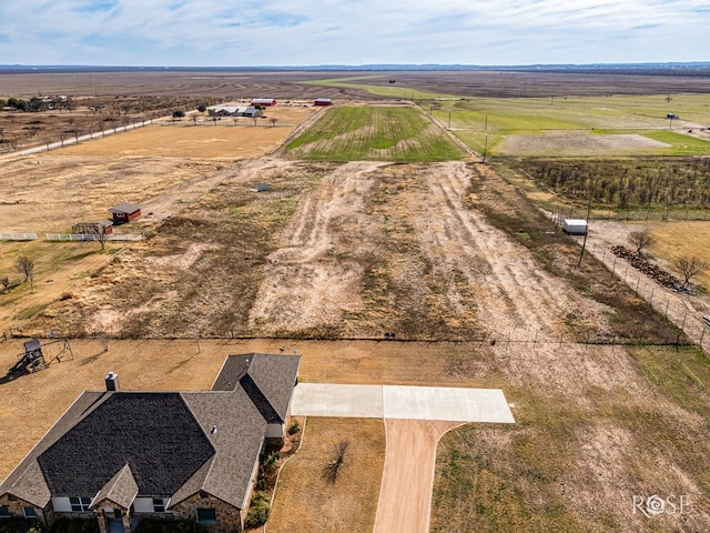 birds eye view of property with a rural view