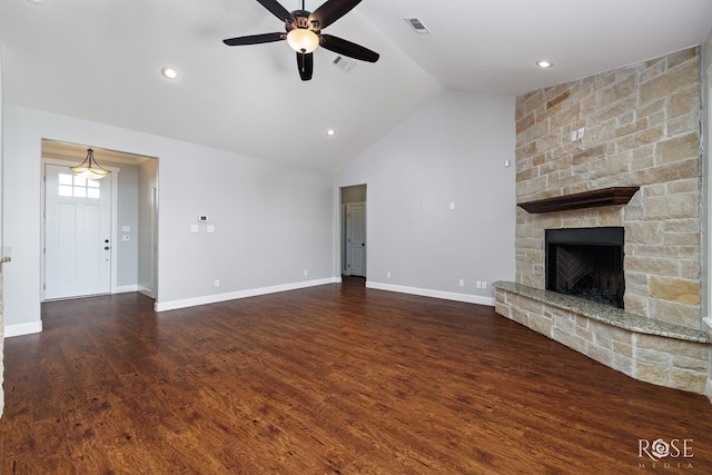 unfurnished living room featuring wood finished floors, baseboards, visible vents, a fireplace, and ceiling fan