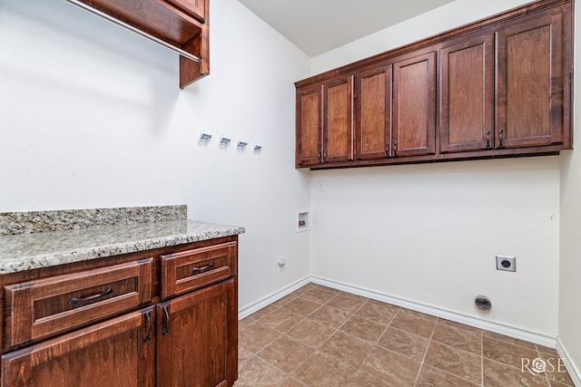 laundry room with baseboards, gas dryer hookup, cabinet space, electric dryer hookup, and washer hookup