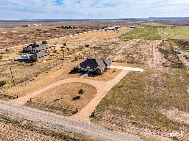 birds eye view of property with a rural view