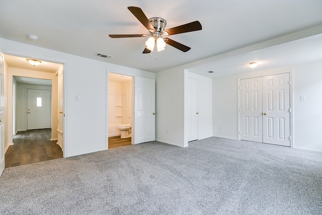 unfurnished bedroom featuring baseboards, visible vents, carpet, and ceiling fan