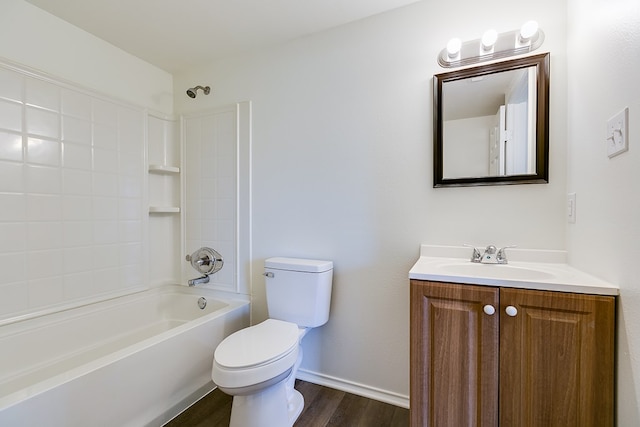 bathroom with wood finished floors, vanity,  shower combination, baseboards, and toilet