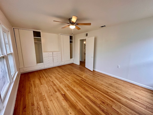 2319 W Beauregard Ave, San Angelo, TX 76901 - unfurnished bedroom featuring light wood-style flooring, baseboards, and a ceiling fan