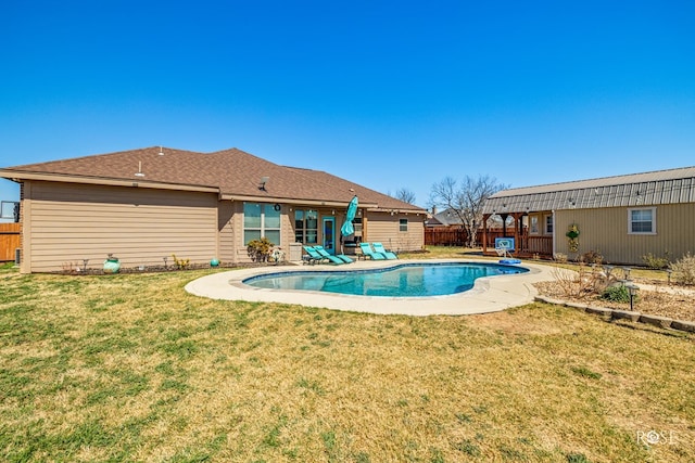 view of pool featuring a fenced in pool, a yard, a patio area, and fence