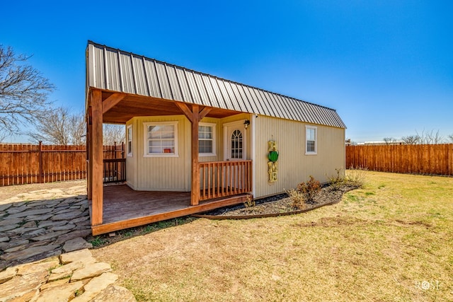 view of outbuilding with an outbuilding and a fenced backyard