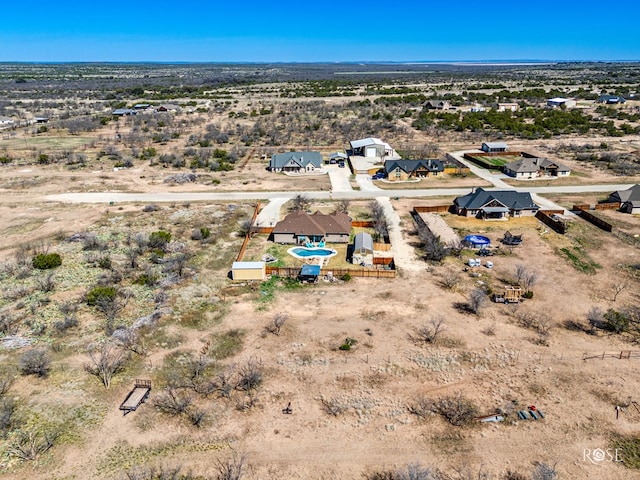 drone / aerial view with view of desert