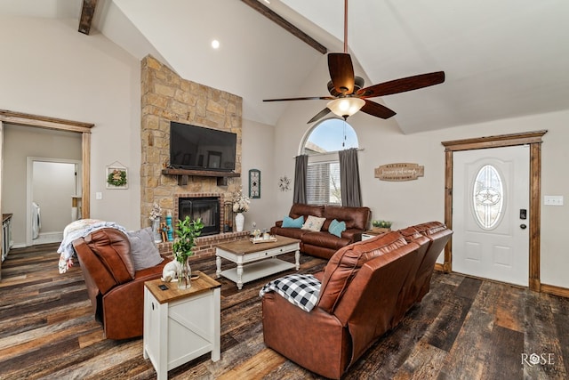 living area featuring a large fireplace, beam ceiling, high vaulted ceiling, and dark wood finished floors