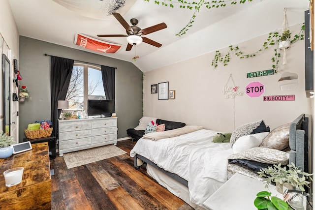 bedroom with lofted ceiling, wood finished floors, and a ceiling fan