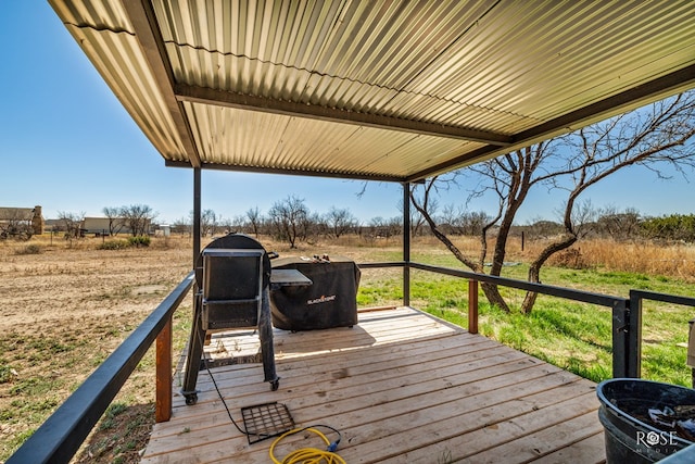 wooden deck with a rural view