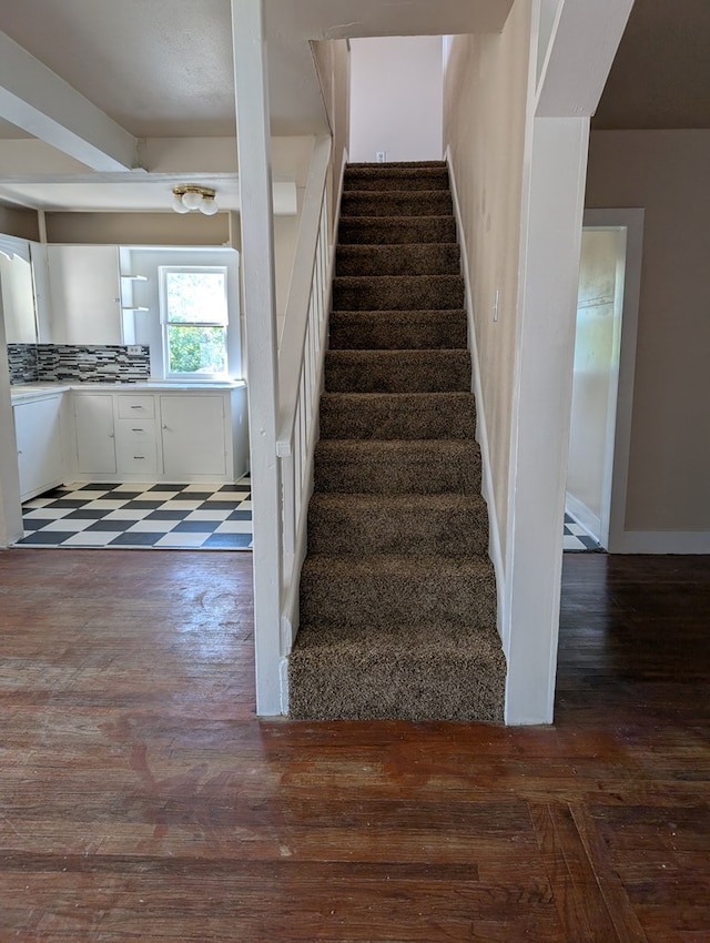 stairs with wood finished floors