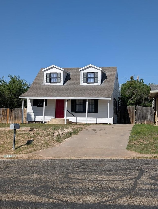 718 N Adams Ave, San Angelo, TX 76901 - new england style home featuring covered porch and driveway