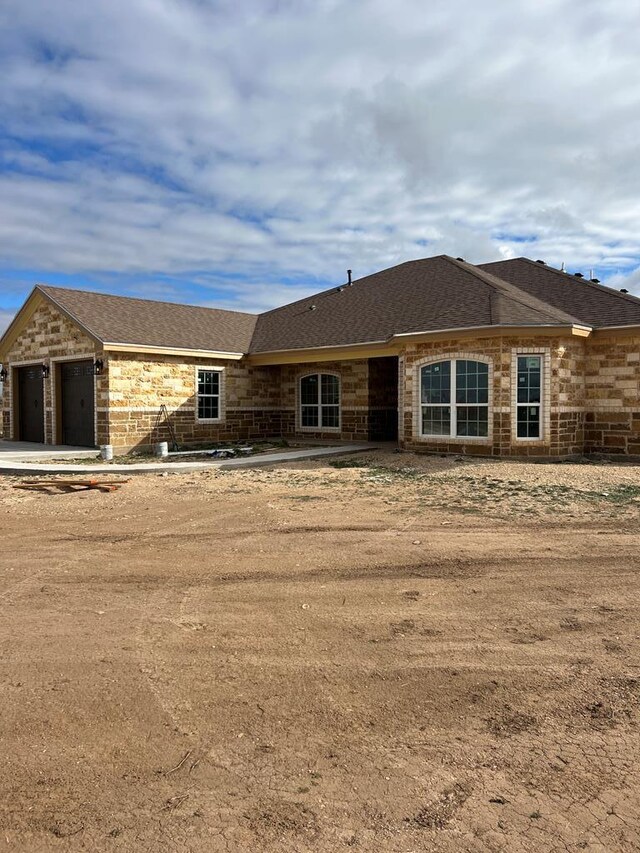 view of front of property with a garage