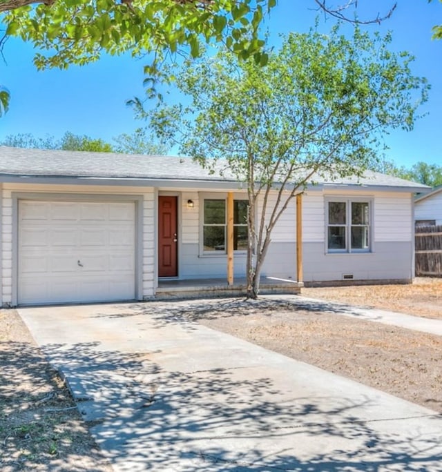 ranch-style house with an attached garage, crawl space, driveway, and roof with shingles