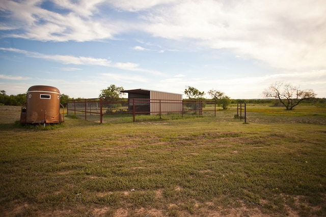 10581 Ballard Rd, San Angelo, TX 76901 - view of yard featuring a pole building, an outbuilding, and a view of countryside