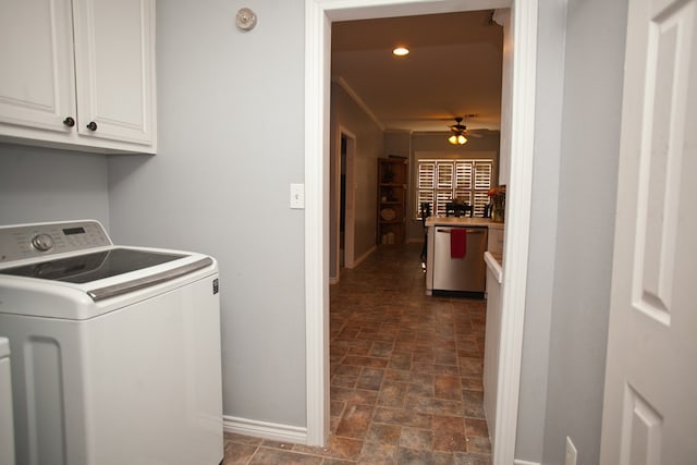 10581 Ballard Rd, San Angelo, TX 76901 - clothes washing area featuring washer / clothes dryer, cabinet space, baseboards, stone finish flooring, and ceiling fan