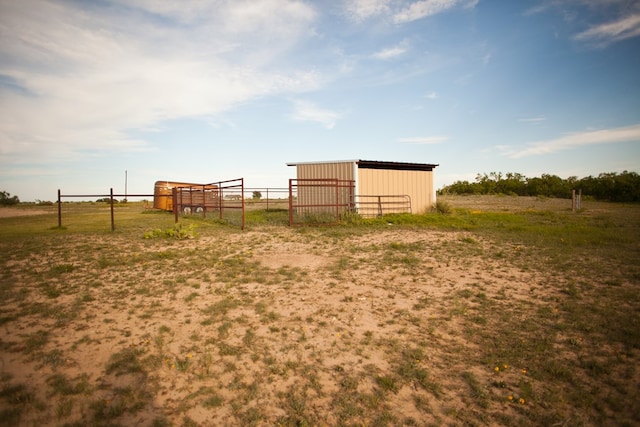 10581 Ballard Rd, San Angelo, TX 76901 - view of yard featuring a pole building, fence, and an outbuilding