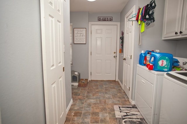 10581 Ballard Rd, San Angelo, TX 76901 - laundry room with cabinet space, stone finish floors, washer and dryer, and baseboards