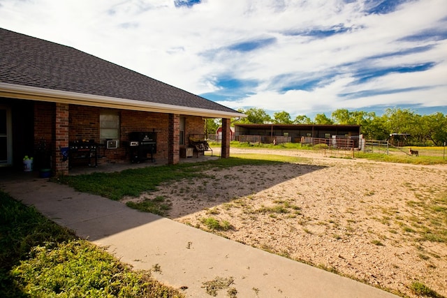 10581 Ballard Rd, San Angelo, TX 76901 - view of yard with an outbuilding and an exterior structure