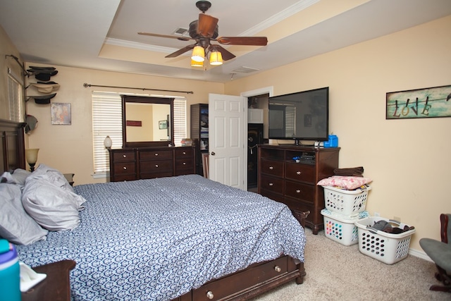10581 Ballard Rd, San Angelo, TX 76901 - bedroom featuring carpet flooring, crown molding, a tray ceiling, and a ceiling fan