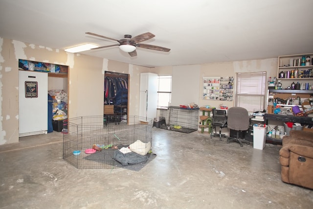 10581 Ballard Rd, San Angelo, TX 76901 - living room featuring a ceiling fan and concrete floors