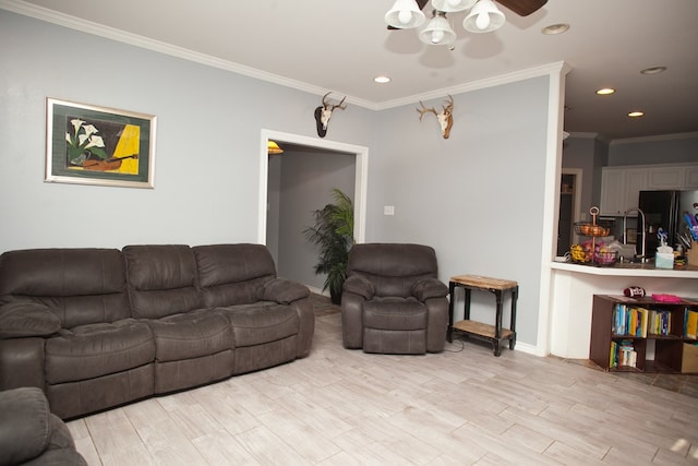 10581 Ballard Rd, San Angelo, TX 76901 - living area featuring ceiling fan, crown molding, recessed lighting, light wood-type flooring, and baseboards