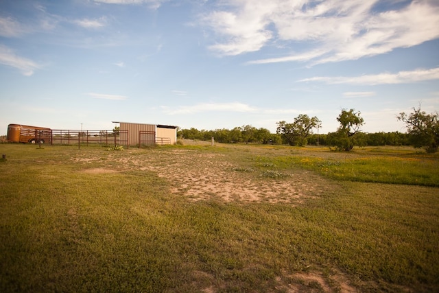 10581 Ballard Rd, San Angelo, TX 76901 - view of yard featuring an outbuilding, an outdoor structure, and a view of countryside