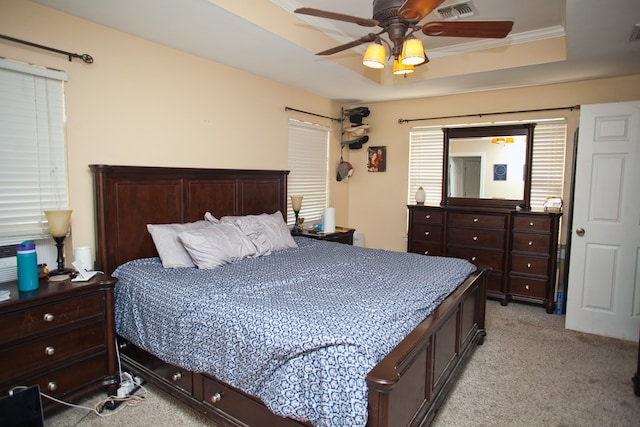 10581 Ballard Rd, San Angelo, TX 76901 - bedroom with light carpet, a raised ceiling, ceiling fan, and crown molding