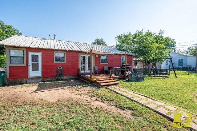113 N Belaire Ave, San Angelo, TX 76905 - rear view of property featuring french doors, a wooden deck, and metal roof