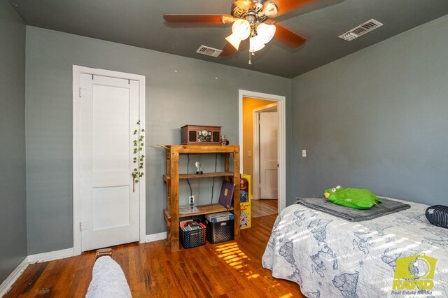 113 N Belaire Ave, San Angelo, TX 76905 - bedroom featuring wood finished floors, baseboards, and a ceiling fan