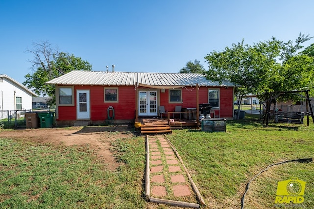 113 N Belaire Ave, San Angelo, TX 76905 - rear view of property with french doors and metal roof