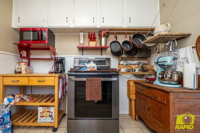 113 N Belaire Ave, San Angelo, TX 76905 - kitchen featuring appliances with stainless steel finishes, white cabinets, and light tile patterned floors