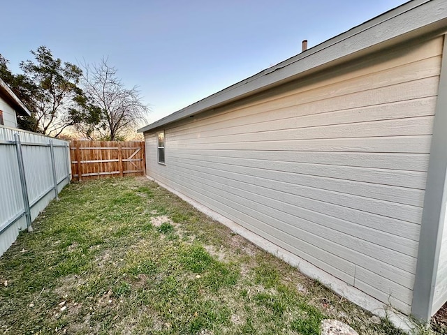 view of home's exterior featuring a yard