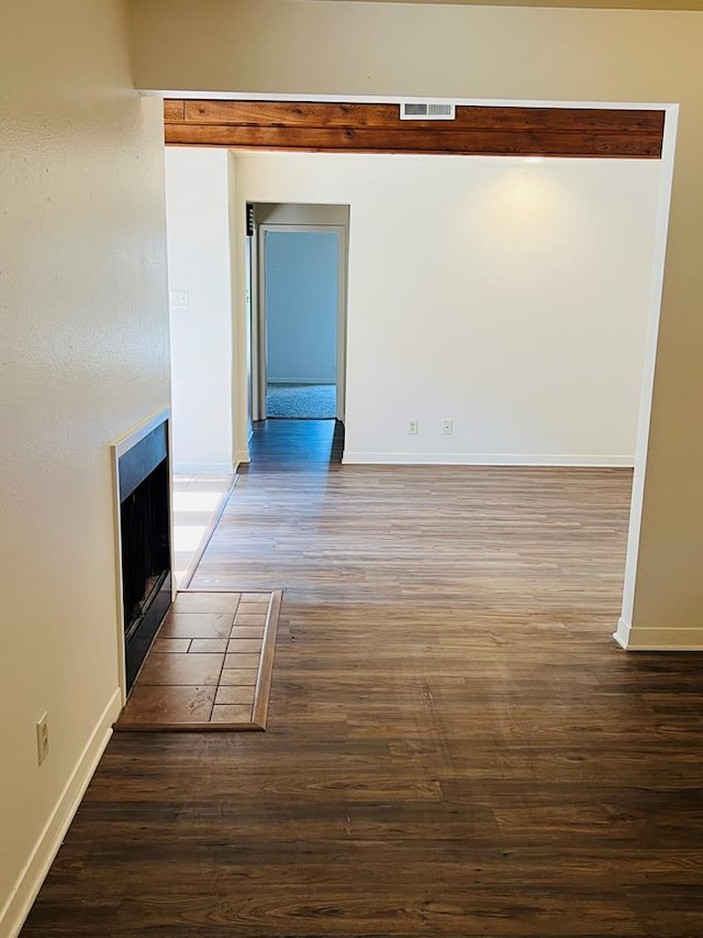 1723 Utah Ave, San Angelo, TX 76904 - spare room featuring wood finished floors and baseboards
