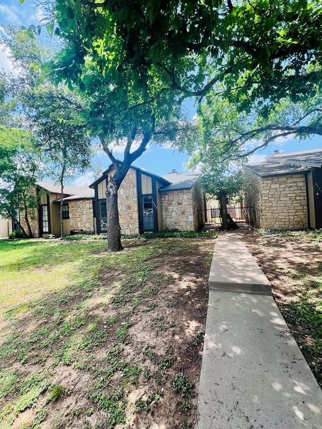 1723 Utah Ave, San Angelo, TX 76904 - mid-century modern home featuring stone siding and an outbuilding